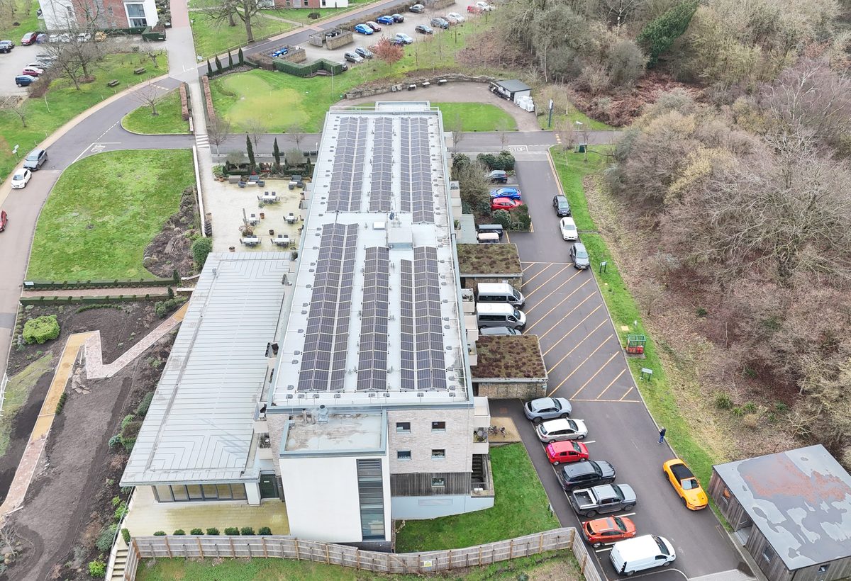 Aerial view of a commercial rooftop solar installation